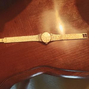 A woman's gold Omega watch